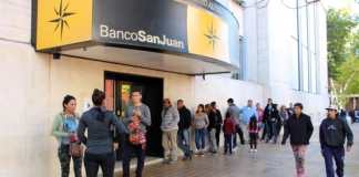Demanda contra el Banco San Juan por cobro indebido de impuestos en compras en dólares